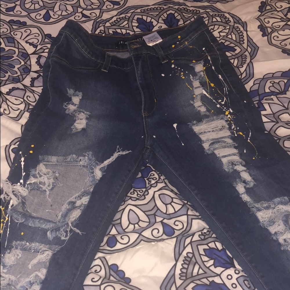 High waist ripped jeans with splattered paint